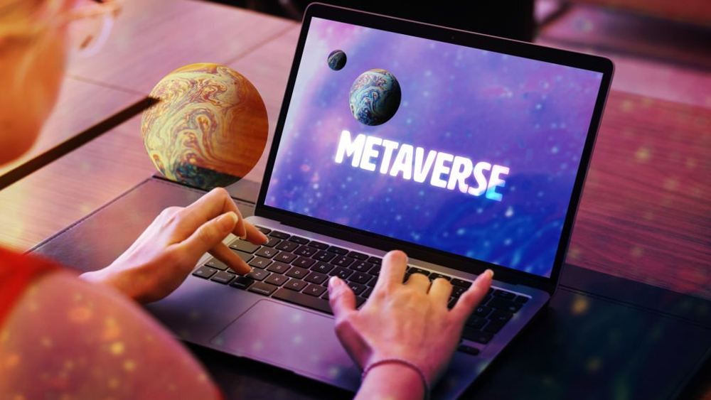 Metaverse concept woman using laptop with planet screen
