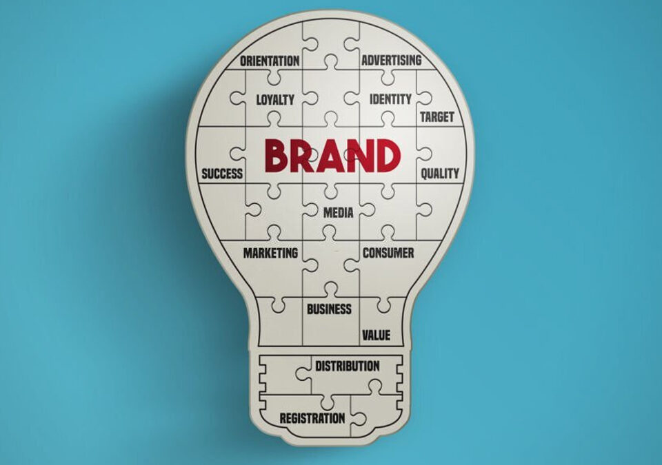 Light bulb puzzle pieces forming the word brand